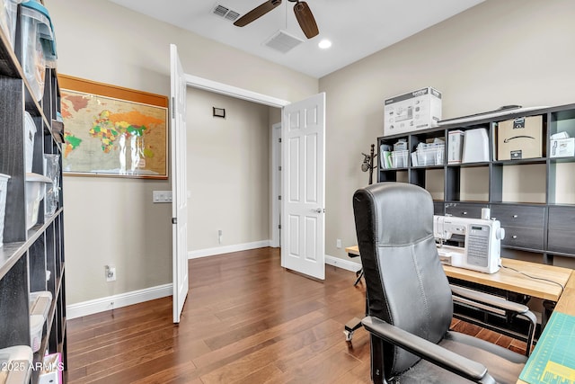 office with baseboards, wood finished floors, visible vents, and a ceiling fan