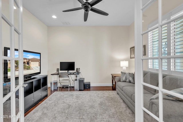 home office featuring baseboards, visible vents, dark wood-type flooring, and french doors