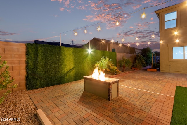 view of patio featuring a fire pit and a fenced backyard