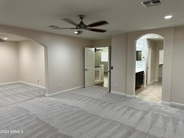 carpeted empty room with ceiling fan