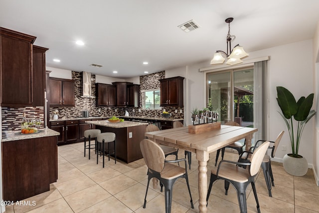 dining room featuring light tile patterned floors, visible vents, recessed lighting, and a notable chandelier