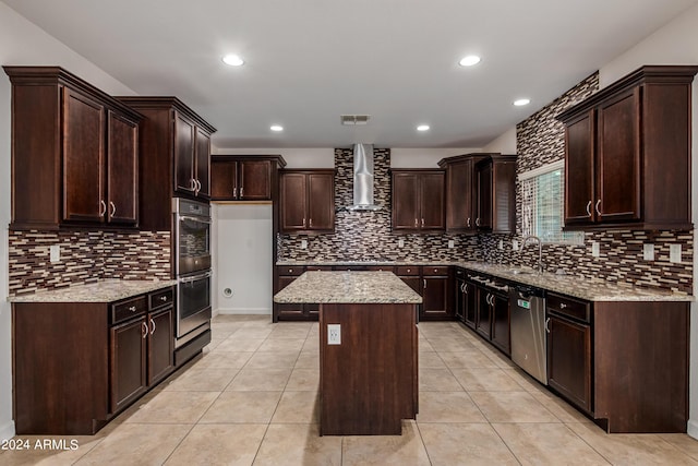 kitchen featuring stainless steel appliances, visible vents, light tile patterned flooring, and wall chimney range hood