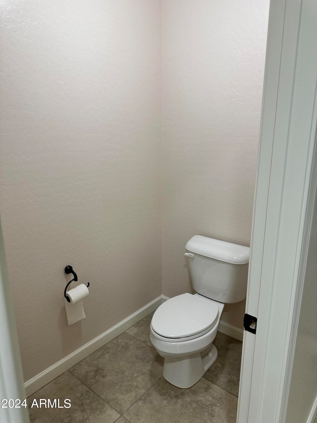 bathroom featuring tile patterned floors and toilet