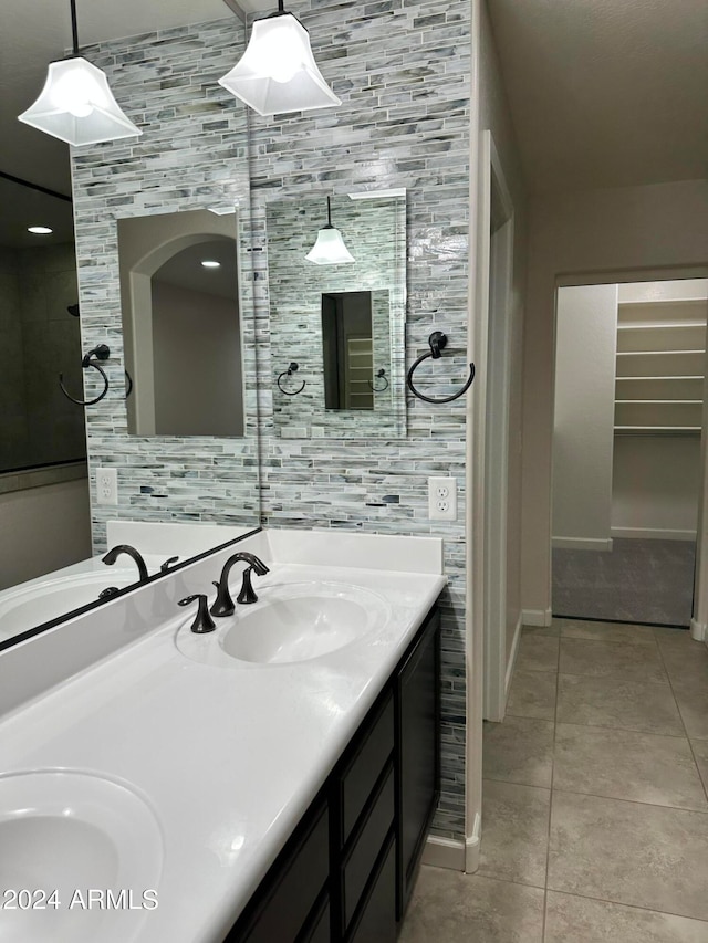 bathroom featuring tile patterned flooring and vanity