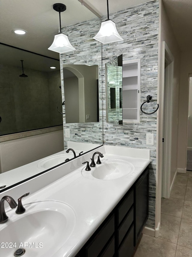 bathroom featuring tile patterned flooring and vanity