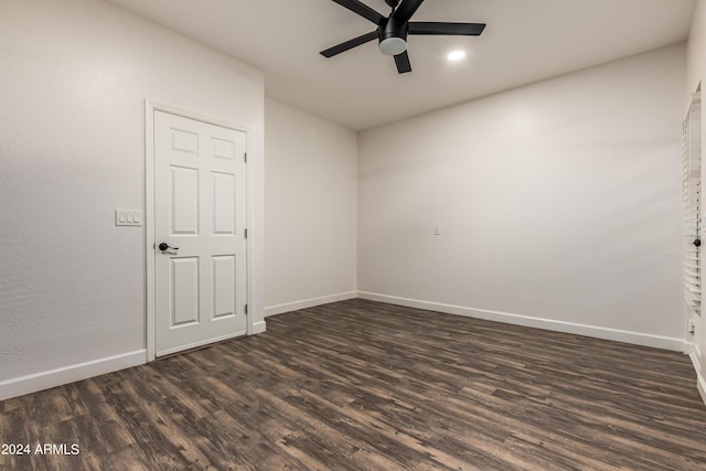 empty room featuring dark wood finished floors, recessed lighting, a ceiling fan, and baseboards