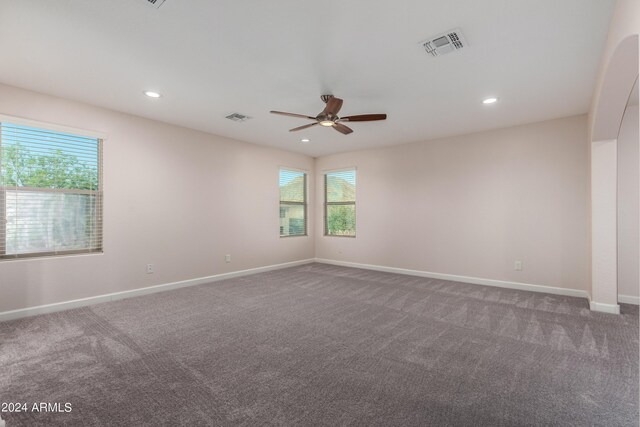 unfurnished bedroom featuring ceiling fan, a closet, and carpet