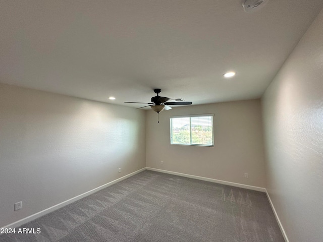 empty room with carpet flooring and ceiling fan