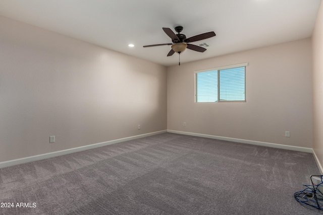 carpeted spare room featuring recessed lighting, baseboards, and a ceiling fan