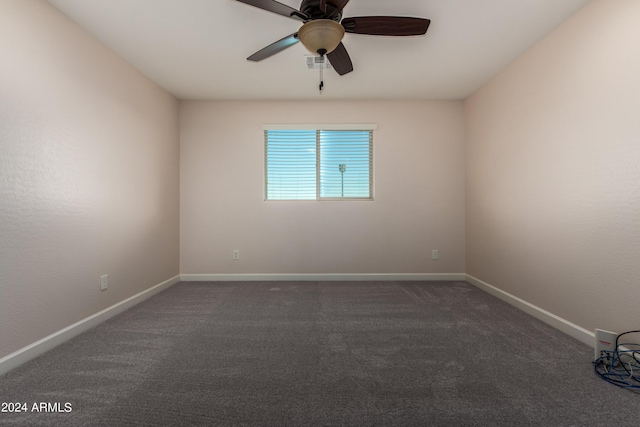 spare room with visible vents, ceiling fan, baseboards, and carpet floors