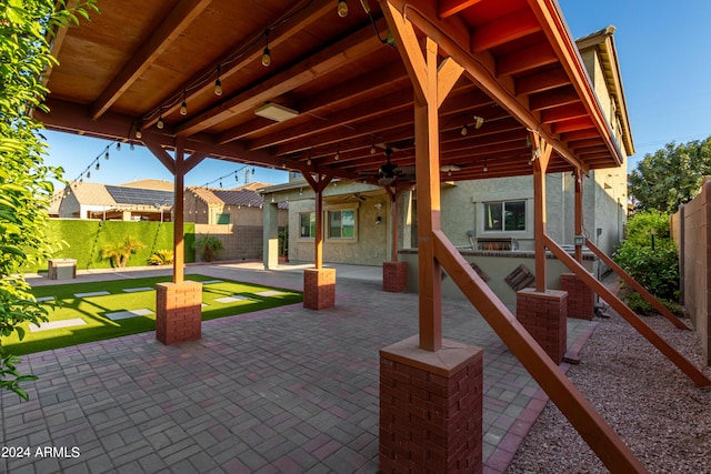 view of patio / terrace with a ceiling fan and a fenced backyard