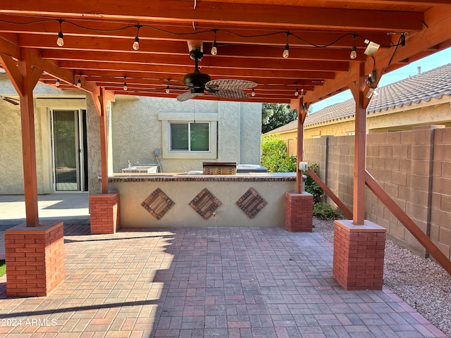 view of patio featuring area for grilling and ceiling fan