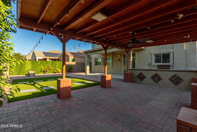 view of patio / terrace featuring a ceiling fan and fence