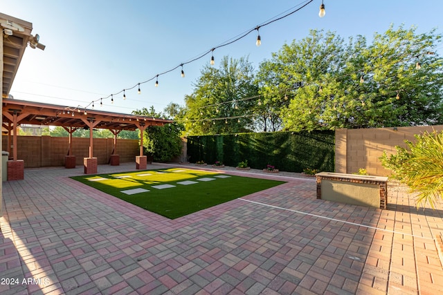 view of yard featuring a patio and a fenced backyard