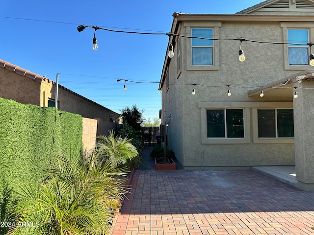 view of property exterior with a patio