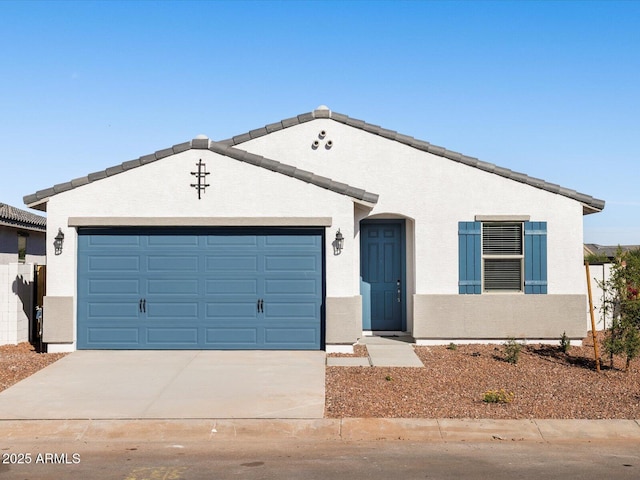 ranch-style home with stucco siding, concrete driveway, and an attached garage