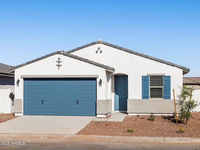 ranch-style house featuring stucco siding, an attached garage, driveway, and a tiled roof