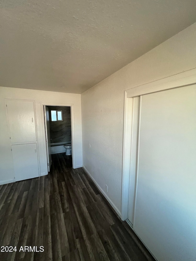 hallway featuring dark hardwood / wood-style floors