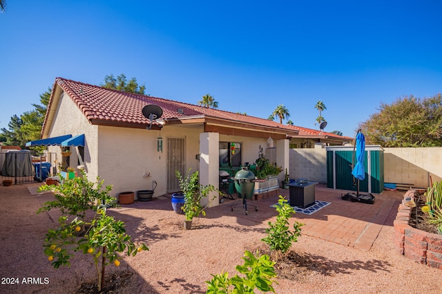 rear view of property with a patio area