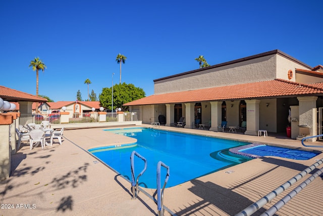 view of swimming pool featuring a patio