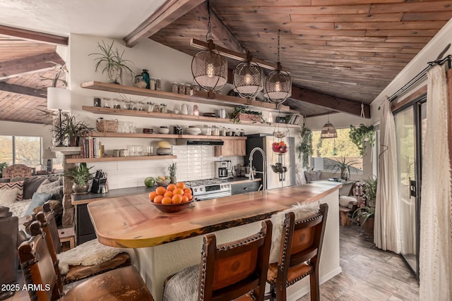 dining room with vaulted ceiling with beams and wooden ceiling