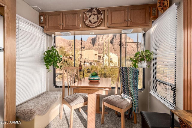 sunroom / solarium with a mountain view