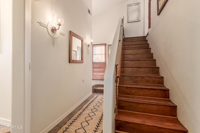 stairs featuring tile patterned flooring