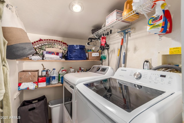 washroom featuring washing machine and dryer