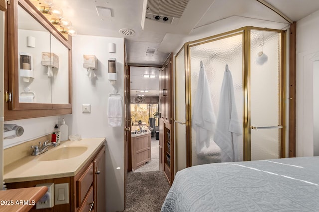 bedroom featuring sink and dark carpet