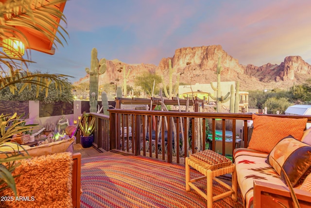 deck at dusk with a mountain view