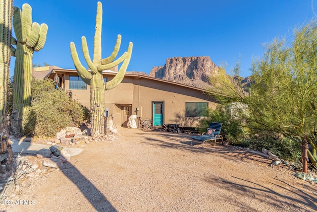 back of house featuring a mountain view