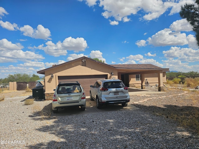 ranch-style home featuring a garage