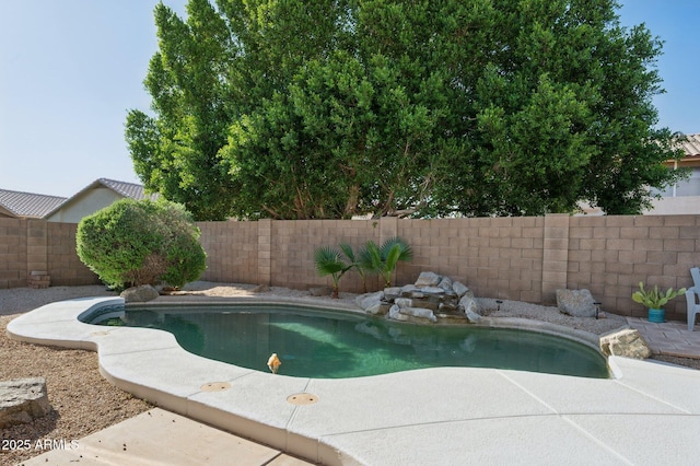 view of swimming pool with a fenced in pool, a patio, and a fenced backyard