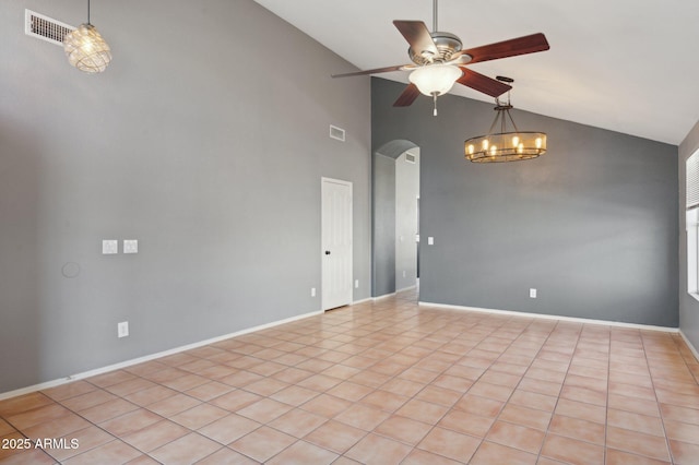 empty room featuring visible vents, arched walkways, ceiling fan with notable chandelier, and high vaulted ceiling