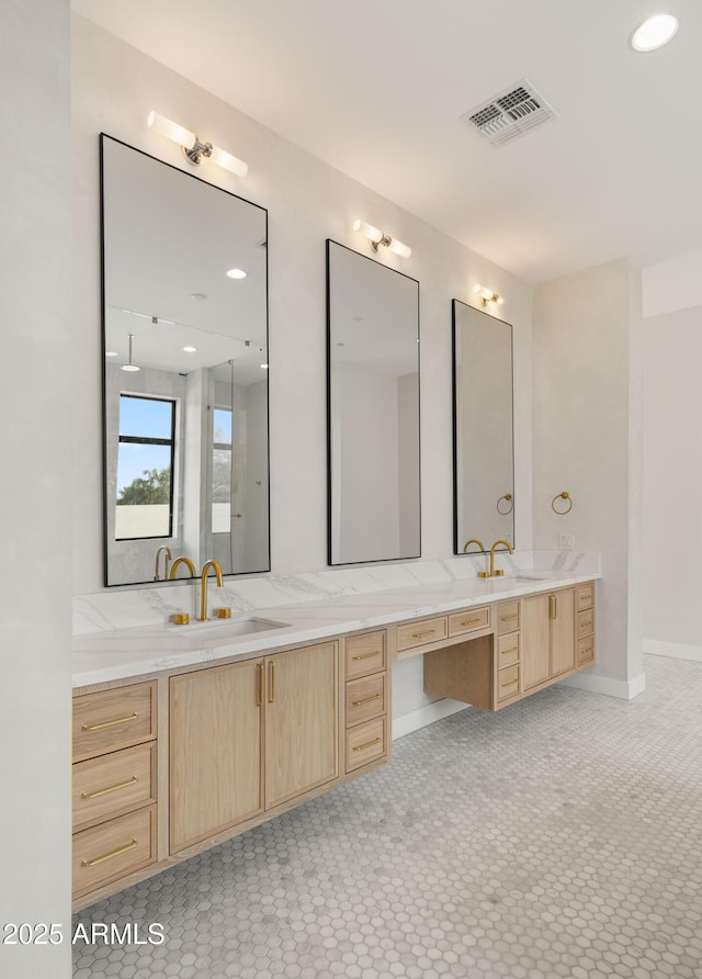 10220 N 66th St, Paradise Valley, AZ 85253 - bathroom with double vanity, visible vents, and a sink