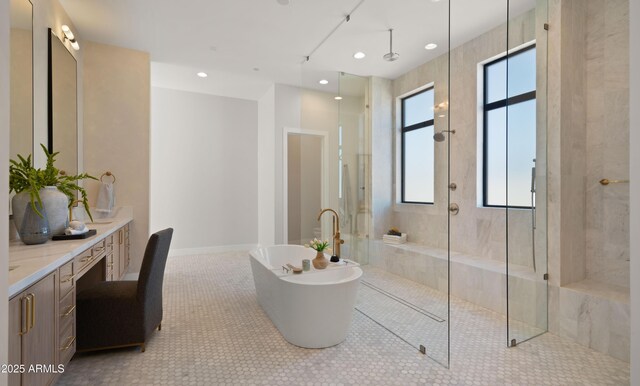 10220 N 66th St, Paradise Valley, AZ 85253 - full bathroom featuring a soaking tub, baseboards, vanity, a walk in shower, and tile patterned flooring