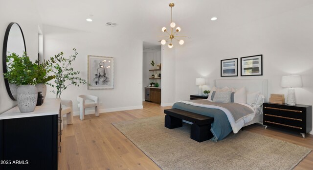 10220 N 66th St, Paradise Valley, AZ 85253 - bedroom with light wood-style flooring, visible vents, an inviting chandelier, and recessed lighting