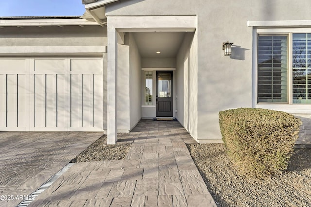 doorway to property with stucco siding