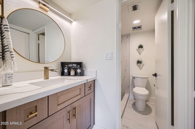 bathroom with visible vents, toilet, marble finish floor, and vanity