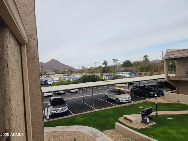 partially covered parking lot with a mountain view