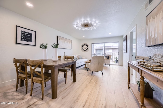 dining room with visible vents, recessed lighting, baseboards, and light wood-style floors