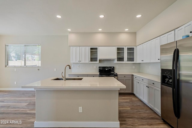 kitchen with a kitchen island with sink, sink, stainless steel refrigerator with ice dispenser, decorative backsplash, and black electric range oven