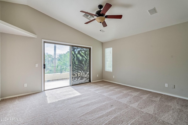 empty room featuring ceiling fan, high vaulted ceiling, light carpet, visible vents, and baseboards