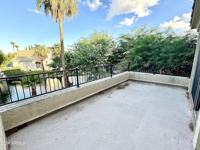 balcony featuring a water view