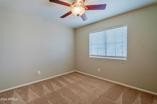 carpeted empty room with ceiling fan