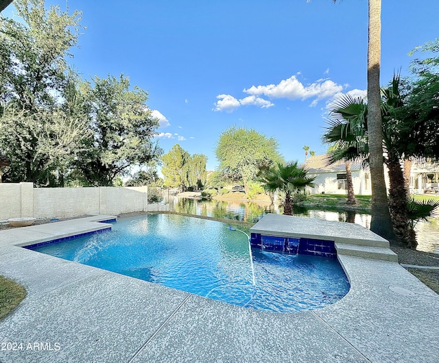 view of swimming pool featuring a water view and pool water feature