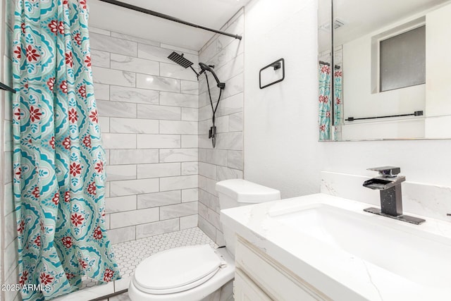 bathroom featuring vanity, a shower with shower curtain, and toilet