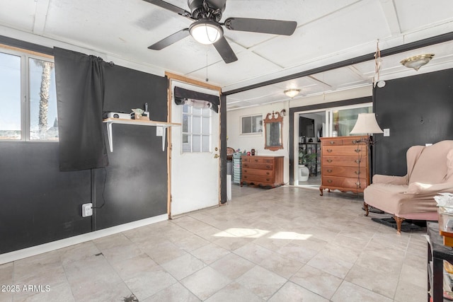 sitting room featuring ceiling fan