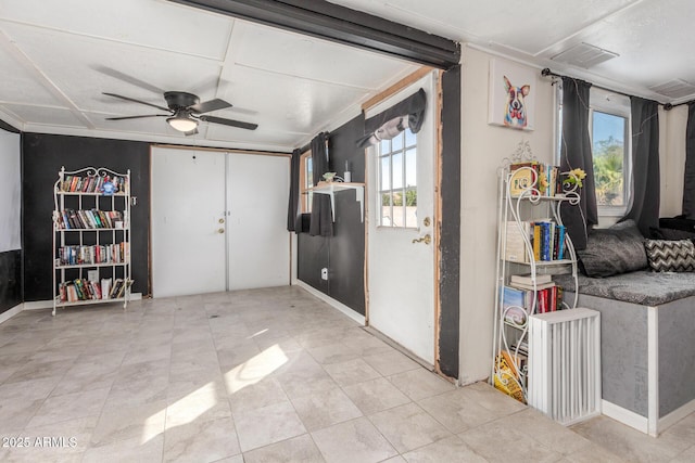 interior space featuring ceiling fan