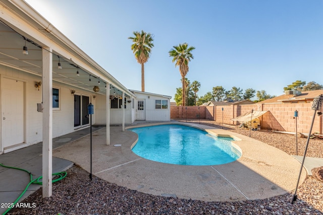 view of swimming pool with a patio